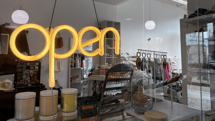 An open sign on a storefront.