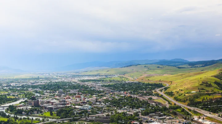 Hill landscape with a small urban area at the foot of the hills