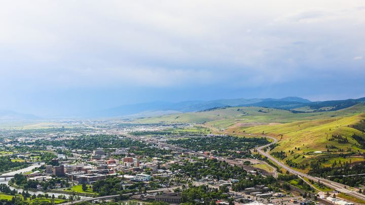Hill landscape with a small urban area at the foot of the hills